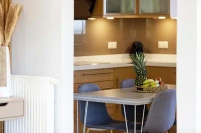 a kitchen with a table with a bowl of fruit on it at Quiet Villa Aviana,garden, heated pool,BBQ,jacuzzi in Gerani Chanion