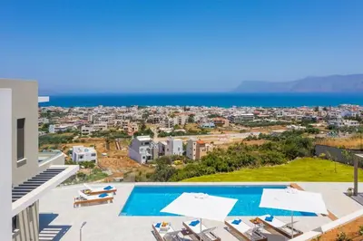a villa with a swimming pool and a view of the ocean at Villa Thea, stunning view, pool, BBQ, Brand new. in Kissamos