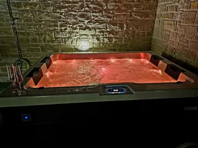a red bath tub in a room with at Splendid Villas and Family Resort in Kalamitsi Amygdali