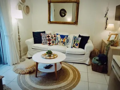 a living room with a couch and a table at Kaldora Apartment in Chania Town