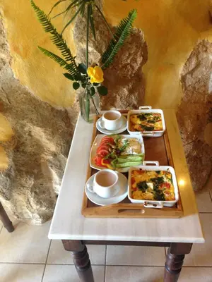a table with two trays of food on it at Samonas - Red villa Fliskouni in Chania Town