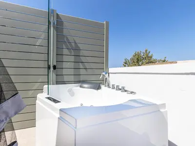 a bathroom with a white sink on a building at Metropolitan Pearl Boutique Hotel in Chania Town