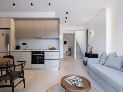 a living room with a couch and a table at JnV Luxury Villas in Chania Town