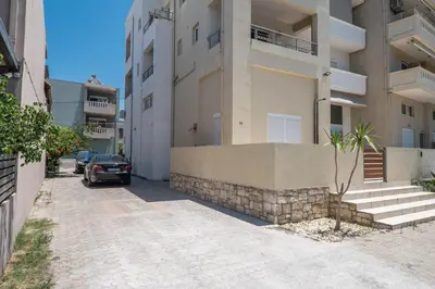 a car parked in front of a building at Ammoutsiani Cozy Apartment 1 by 8essentially in Chania Town