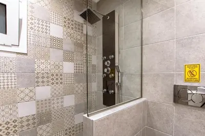 a shower with a glass door in a bathroom at Kares Dream House in Chania Town