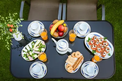 a picnic table with food and drinks on it at Kares Dream House in Chania Town