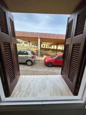 a view of two cars parked in a parking lot at Stef&Art Old Town House in Chania Town