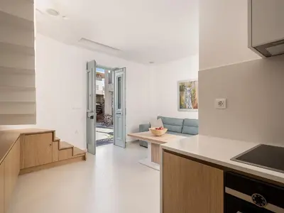a kitchen and living room in a house at Mythodea Luxury Suites in Chania Town