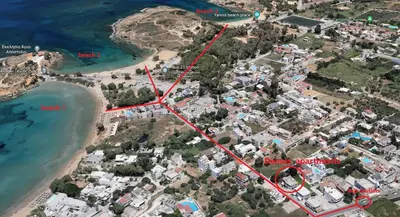 an aerial view of a beach with a red map at Dennis Cozy Apartment near the Beach in Kato Daratso