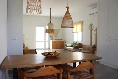a dining room with a table with a bowl of fruit on it at Cassandra's Haven in Kissamos