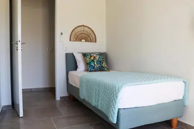 a small bedroom with a bed with a pillow on it at Cassandra's Haven in Kissamos