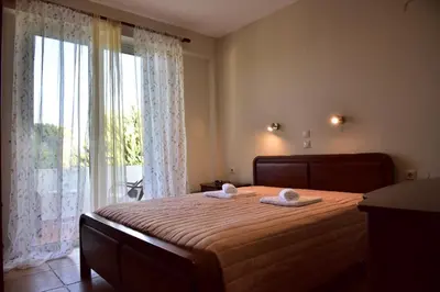 a bedroom with a bed with two towels on it at VILLA BLUE VEDERE in Gerani Chanion