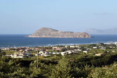 an island in the ocean with a town and houses at VILLA BLUE VEDERE in Gerani Chanion