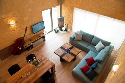 an overhead view of a living room with a couch and a table at Conte Marino Villas in Maleme