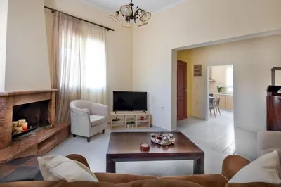 a living room with a couch and a fireplace at Casa Alta 2-bedroom House in Manoliópoulon