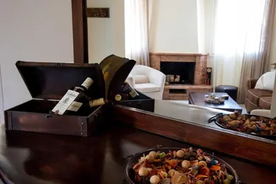 a box with a bottle of wine and a plate of food at Casa Alta 2-bedroom House in Manoliópoulon