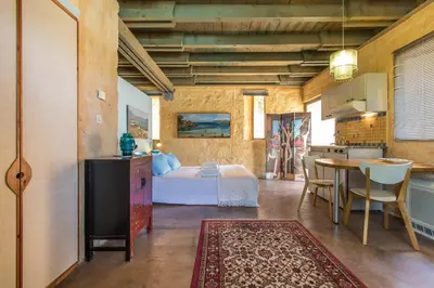 a bedroom with a bed and a table in a room at Villa Catani in Kalamaki Chanion