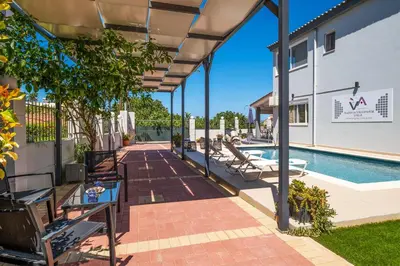a patio with a pool and a building at Villa Artemis A&B in Chania Town