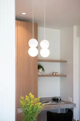 a kitchen with a bunch of lights hanging from the ceiling at Mondethea vantage point home in Chania Town