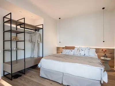 a bedroom with a large bed and a closet at Mondethea vantage point home in Chania Town
