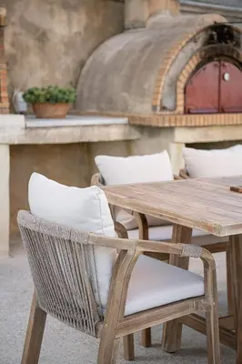 a wooden table and chairs with a wooden table and a counter at Mondethea vantage point home in Chania Town