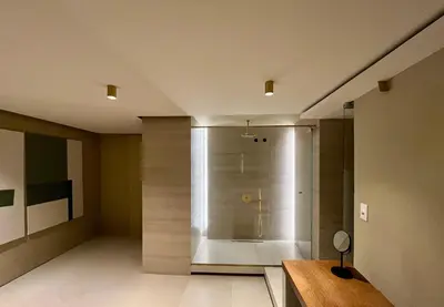 a large shower in a room with a wooden table at Thirty8 Heritage House in Chania Town