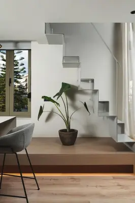 a potted plant sitting on a bench in a living room at Urban Lofts in Chania Town