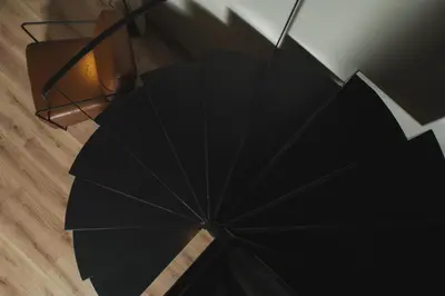 a black umbrella sitting on the floor next to a lamp at Urban Lofts in Chania Town