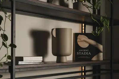 a shelf with a coffee mug and a book at Urban Lofts in Chania Town