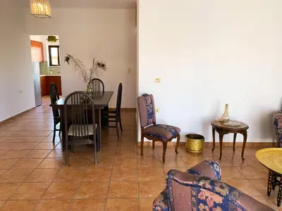 a dining room with chairs and a table and a dining room at CENTRAL HUGE LUXURY APARTMENT and FREE PARKING in Chania Town