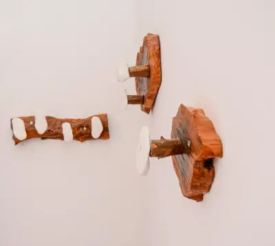 two pieces of wood hanging on a wall at Rubini City Apartment in Chania Town