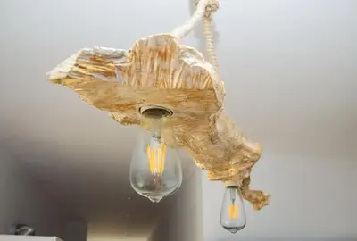 a chandelier with a shell hanging from a ceiling at Rubini City Apartment in Chania Town