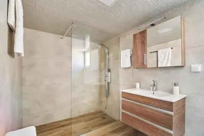 a bathroom with a sink and a shower at Bella Apartment in Kissamos