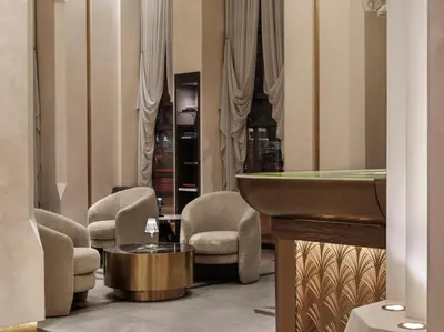 a salon with chairs and a mirror and a sink at The Chania Hotel Crete, Vignette Collection in Chania Town