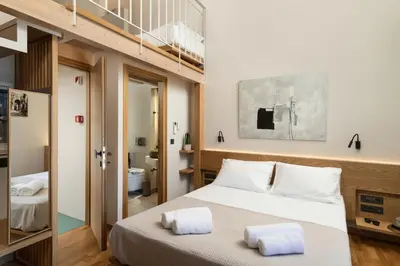 a bedroom with a bed with two towels on it at Ontas IK18 in Chania Town