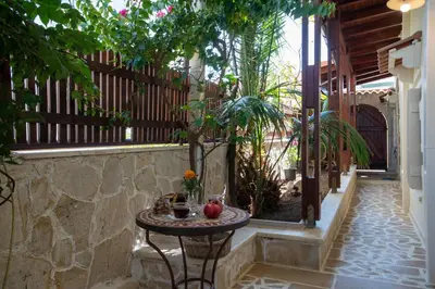 a table with an apple on it in a courtyard at casa di nonna in Chania Town