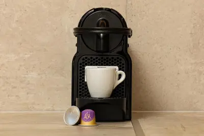 a coffee maker with a cup on a table at Villa Mari Chania, with private ecologic pool and amazing view! in Chania Town