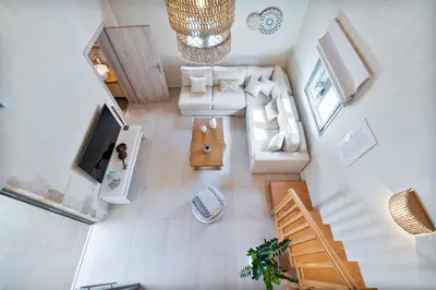 an overhead view of a living room with a couch and a tv at The Violin House in Chania Town