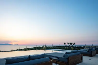a living room with couches and a view of the ocean at Vista Residence in Chania Town