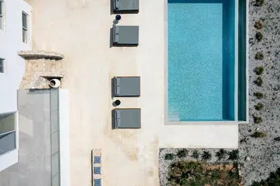 an external view of a building with a swimming pool at Vista Residence in Chania Town