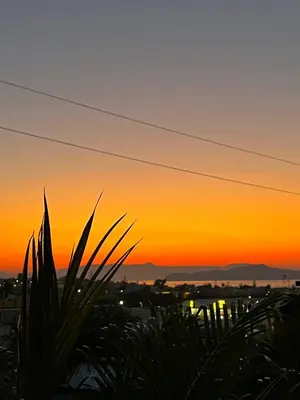 a sunset view from the roof of a building at Solis Occasum in Aghii Apostoli