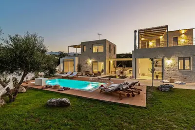 a house with a swimming pool in the yard at Annassa Experience Villa 2' walk from Almyrida beach in Almirida