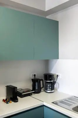 a kitchen counter with a coffee maker and a coffeemaker at Chania Central Apartment in Chania Town