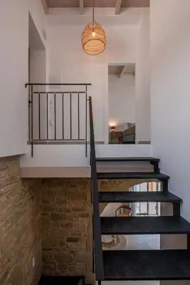 a staircase leading to the second floor of a house at Alma Natura Villas Falasarna - Aposperitis Villa in Falasarna