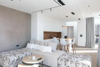 a living room with a couch and a table at Villa Anasa in Palaiochóra