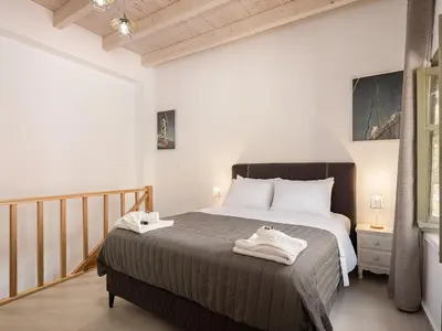 a bedroom with a large bed in a room at Vaggelis house in Chania Town