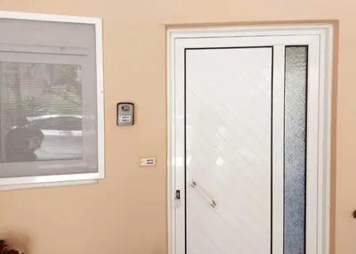 a white door in a room with a window at Argy Cozy Apartment (Όμορφο Διαμέρισμα στα Χανιά) in Chania Town