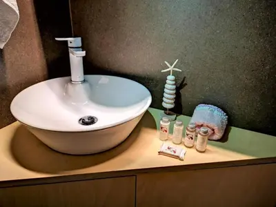 a bathroom with a sink and a counter with a sink at Alendra's City Center Studio in Chania Town