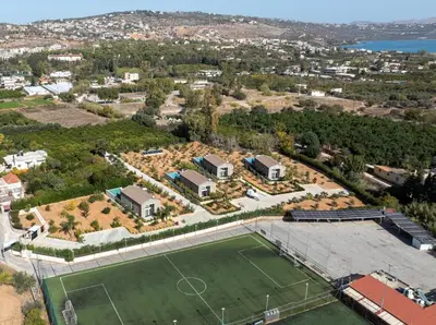 an aerial view of a tennis court and a soccer field at Fairytale Villas in Souda