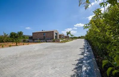 an empty road in front of a building at Fairytale Villas in Souda